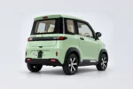 Mintgroene Scheelen Skyliner TS schuin van rechtsachter, met gesloten achterklep en zwarte raamomlijsting.